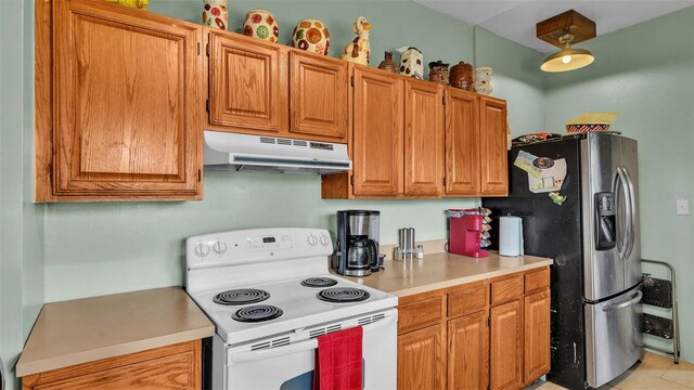 kitchen featuring white electric range, stainless steel refrigerator with ice dispenser, and light tile patterned flooring