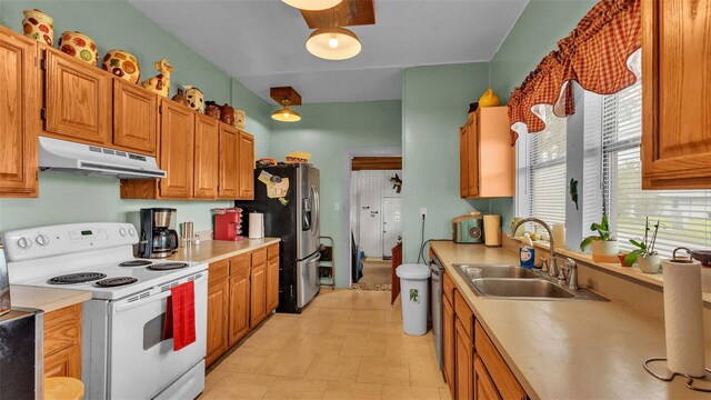 kitchen with appliances with stainless steel finishes and sink