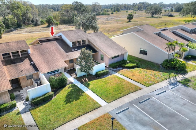 birds eye view of property with a rural view