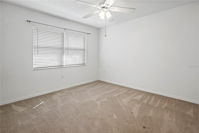 unfurnished room with light carpet, a textured ceiling, and ceiling fan