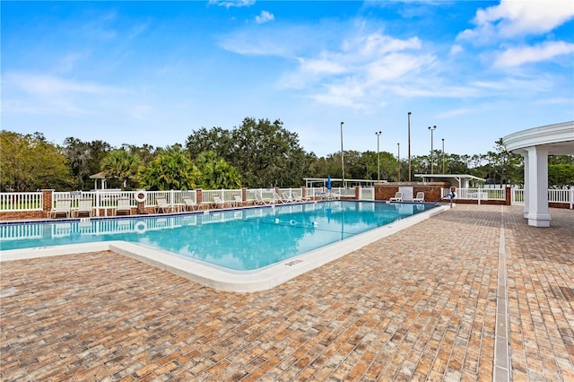 view of swimming pool with a patio