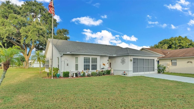 ranch-style home with a front yard and a garage