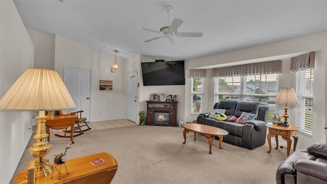 carpeted living room featuring ceiling fan