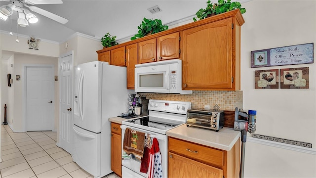 kitchen with light tile patterned flooring, backsplash, white appliances, crown molding, and ceiling fan