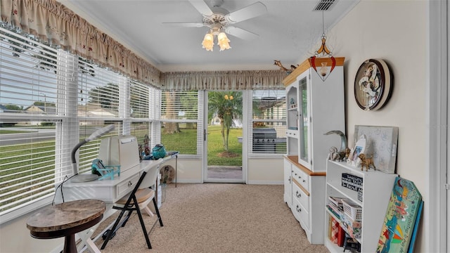 sunroom / solarium featuring ceiling fan and a healthy amount of sunlight