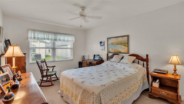 bedroom with light carpet and ceiling fan