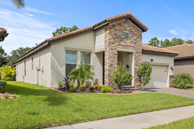 mediterranean / spanish-style house featuring a front yard and a garage