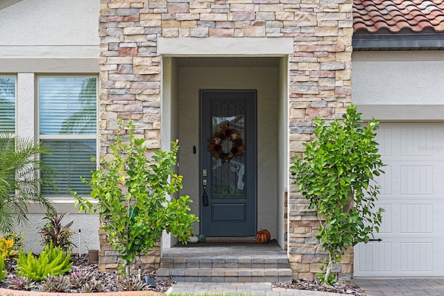 property entrance with a garage