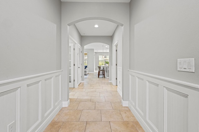 corridor featuring light tile patterned floors