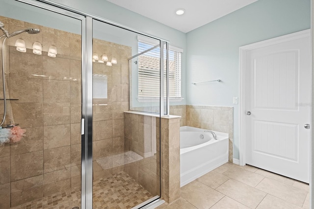 bathroom featuring plus walk in shower and tile patterned flooring