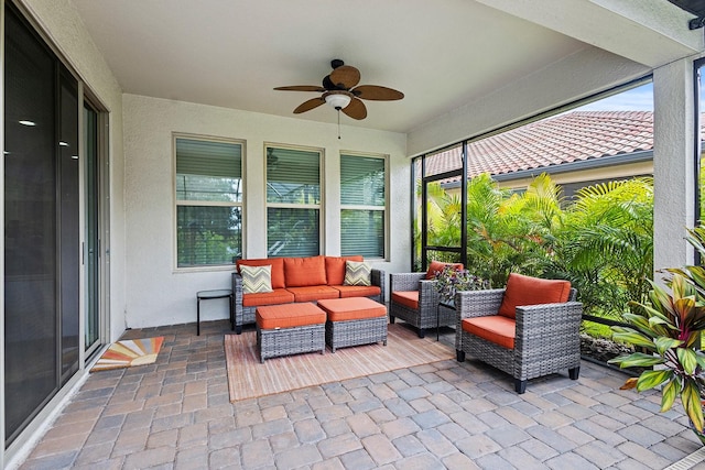 view of patio with outdoor lounge area and ceiling fan