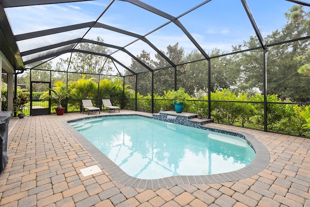 view of pool featuring a lanai and a patio