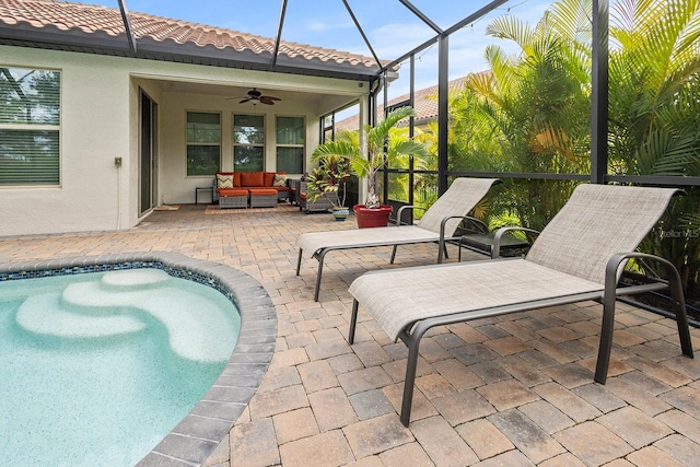 exterior space featuring ceiling fan, an outdoor hangout area, a patio area, and a lanai