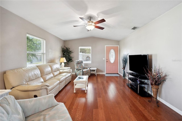 living room featuring ceiling fan, lofted ceiling, and dark wood-type flooring