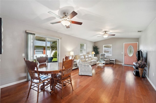 dining room featuring lofted ceiling, ceiling fan, and hardwood / wood-style floors