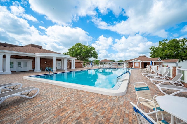 view of swimming pool featuring a patio area