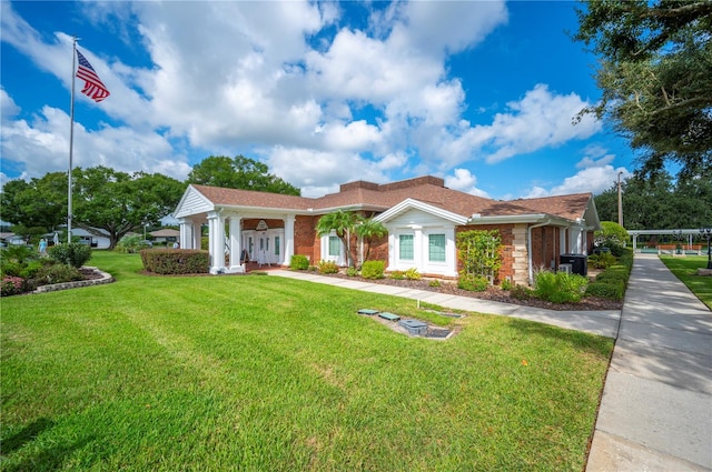 single story home with a front yard