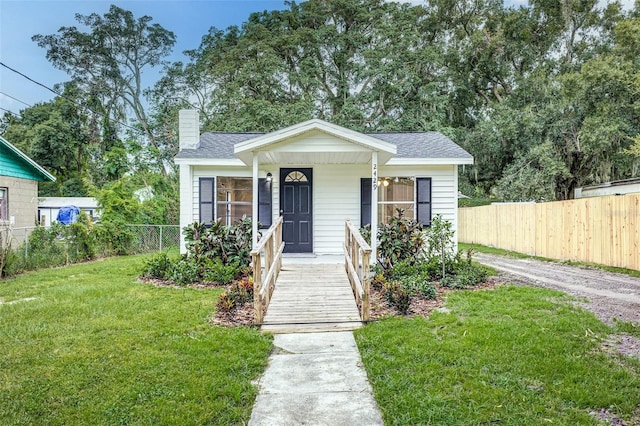 bungalow-style house with a front yard