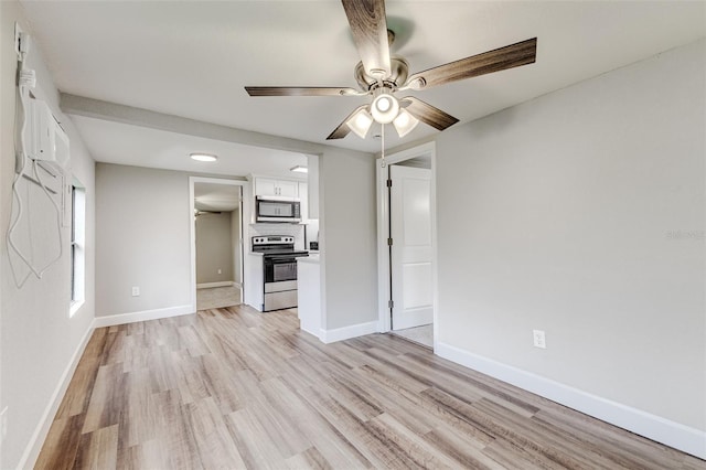 unfurnished living room with light wood-type flooring and ceiling fan