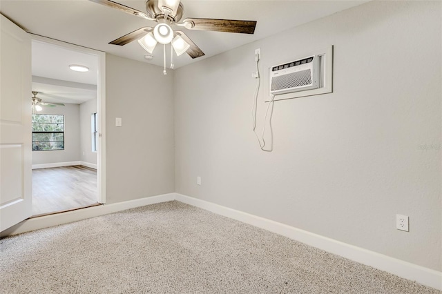 unfurnished room featuring an AC wall unit, ceiling fan, and carpet floors