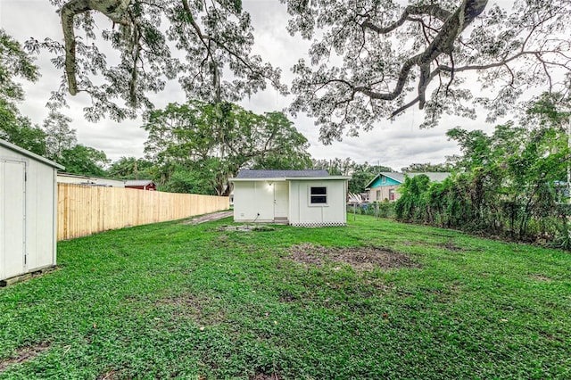 view of yard with a storage unit