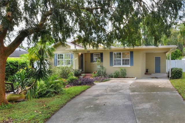 ranch-style home with fence