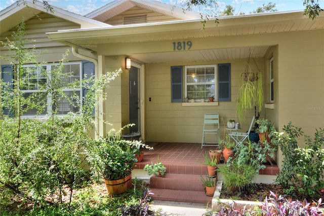 entrance to property featuring a porch