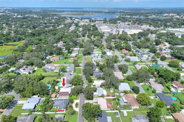 drone / aerial view with a water view and a residential view