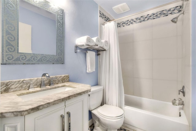 bathroom featuring shower / tub combo with curtain, vanity, and toilet