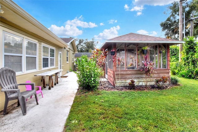 exterior space with a sunroom and a front lawn