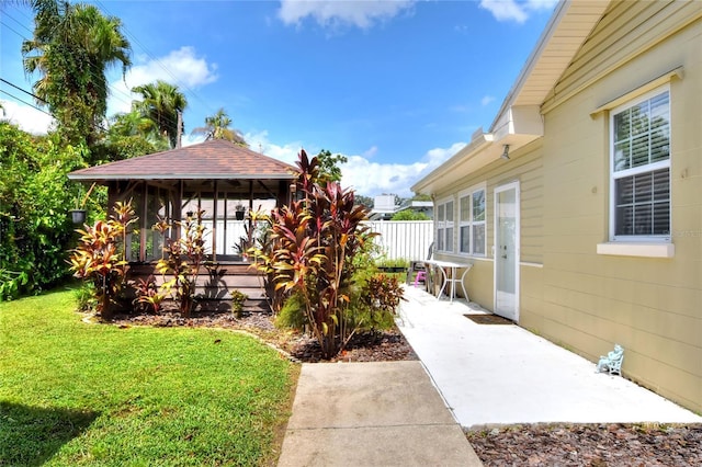 view of yard with a patio and fence