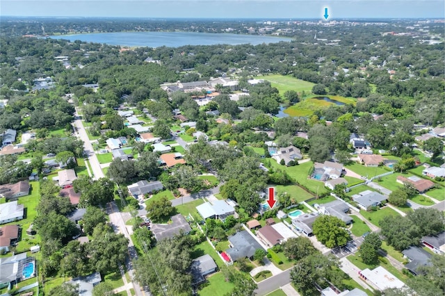 birds eye view of property with a residential view and a water view