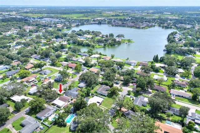 drone / aerial view featuring a water view and a residential view