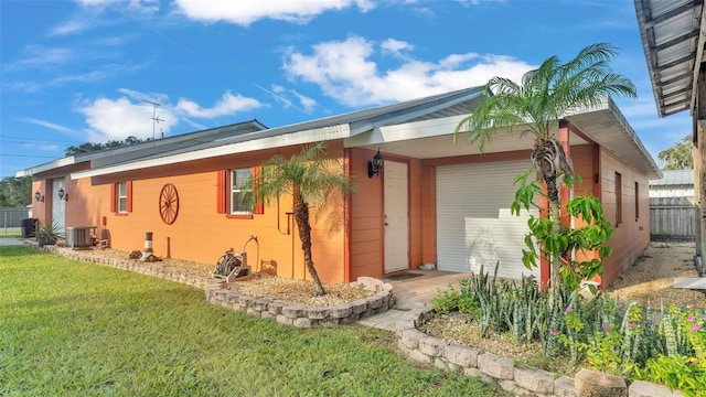 4390 Sunnyside Dr, Lakeland, FL 33810 - single story home with central AC, fence, and a front lawn