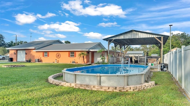 4390 Sunnyside Dr, Lakeland, FL 33810 - view of swimming pool featuring a fenced in pool, central AC, a fenced backyard, and a lawn