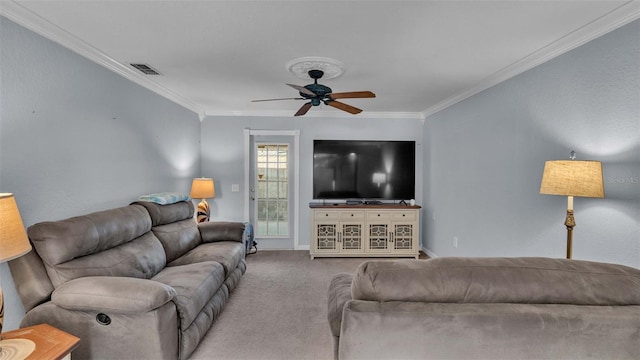 carpeted living room featuring crown molding and ceiling fan