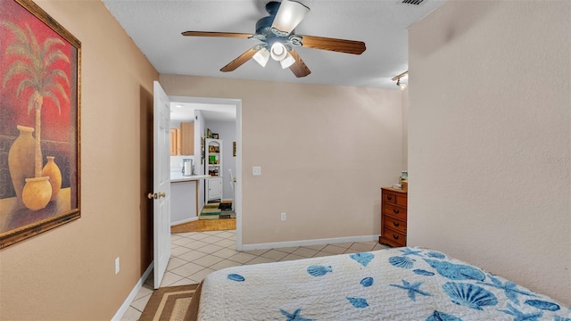 tiled bedroom with ceiling fan