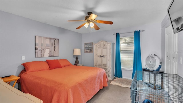 bedroom featuring ceiling fan, a closet, and carpet