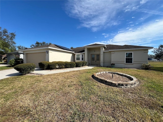 view of front of house featuring a front yard and a garage