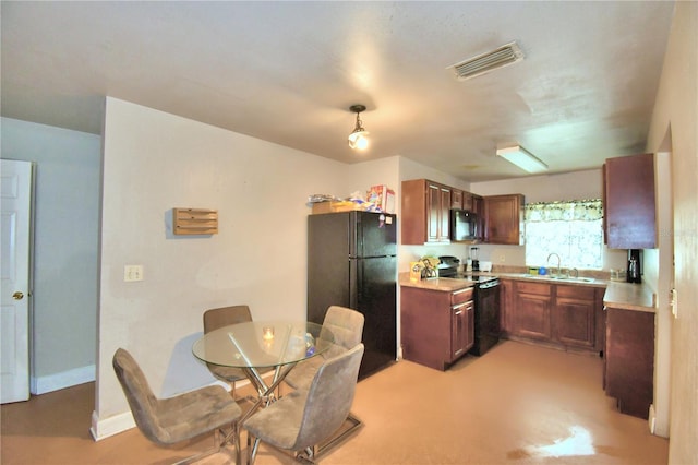 kitchen with black appliances and sink