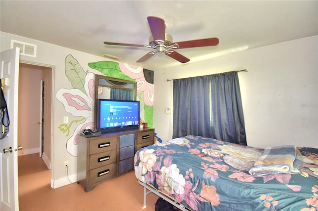 bedroom featuring light carpet and ceiling fan