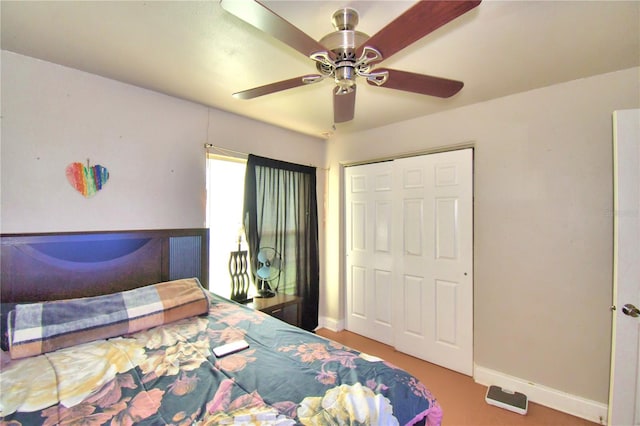 bedroom featuring ceiling fan and a closet