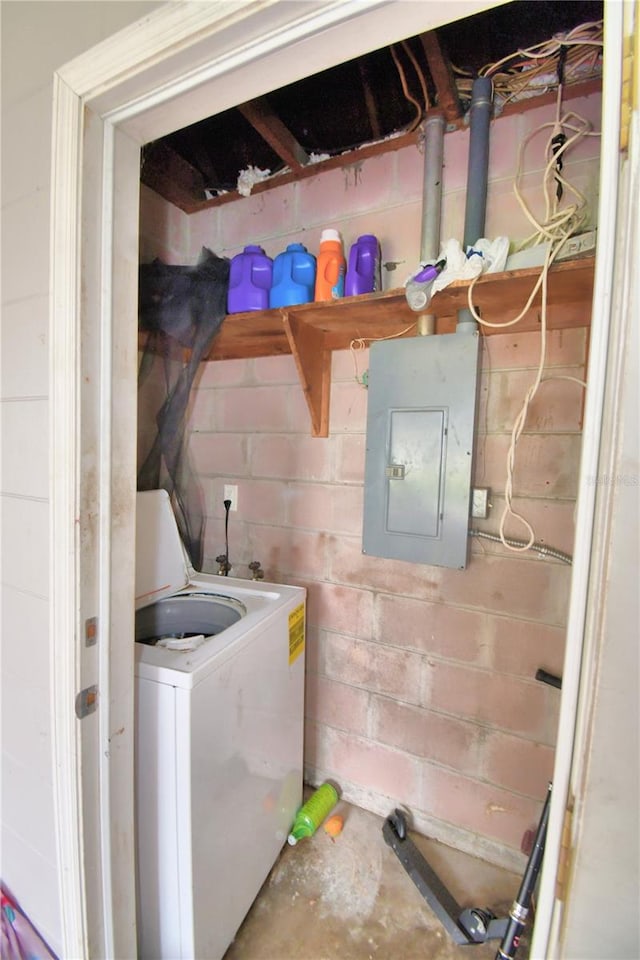 laundry room featuring washer / clothes dryer and electric panel