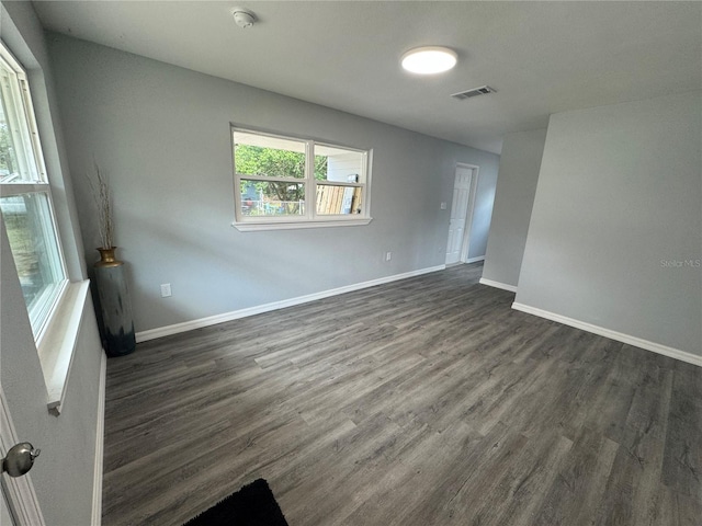 unfurnished room featuring dark hardwood / wood-style floors