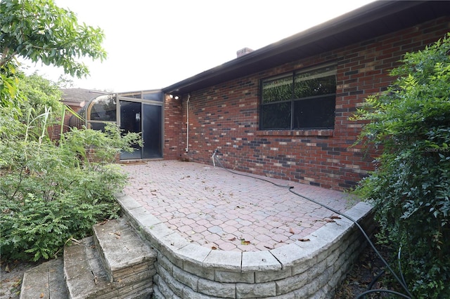 view of patio / terrace with glass enclosure