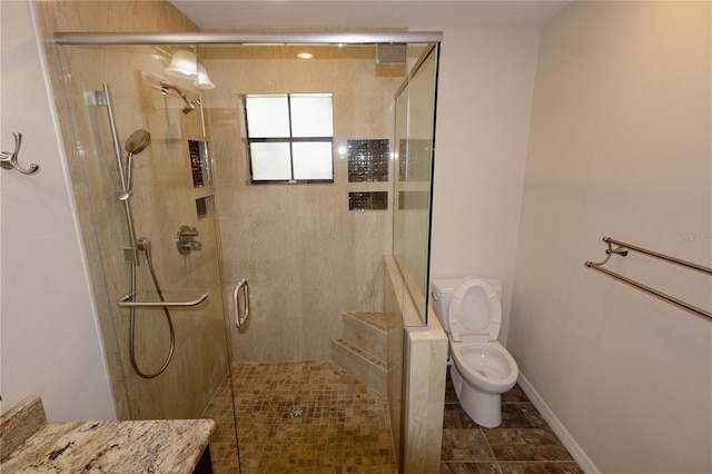 bathroom featuring toilet, vanity, and walk in shower