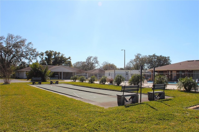 view of home's community featuring a yard