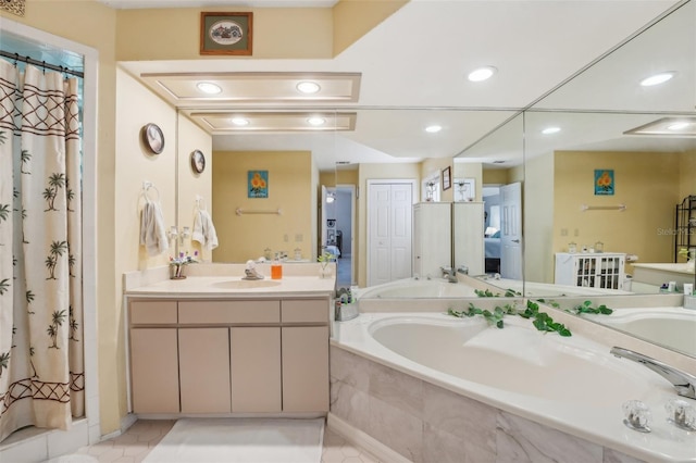 bathroom featuring plus walk in shower, vanity, and tile patterned floors