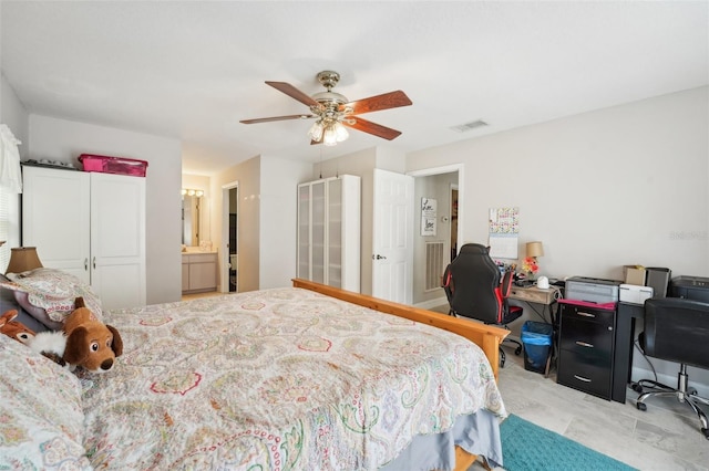 bedroom with ceiling fan and ensuite bathroom