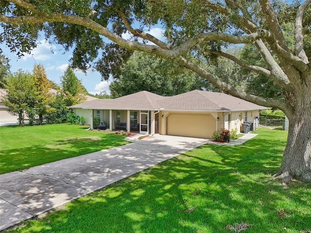 ranch-style home with a garage and a front yard